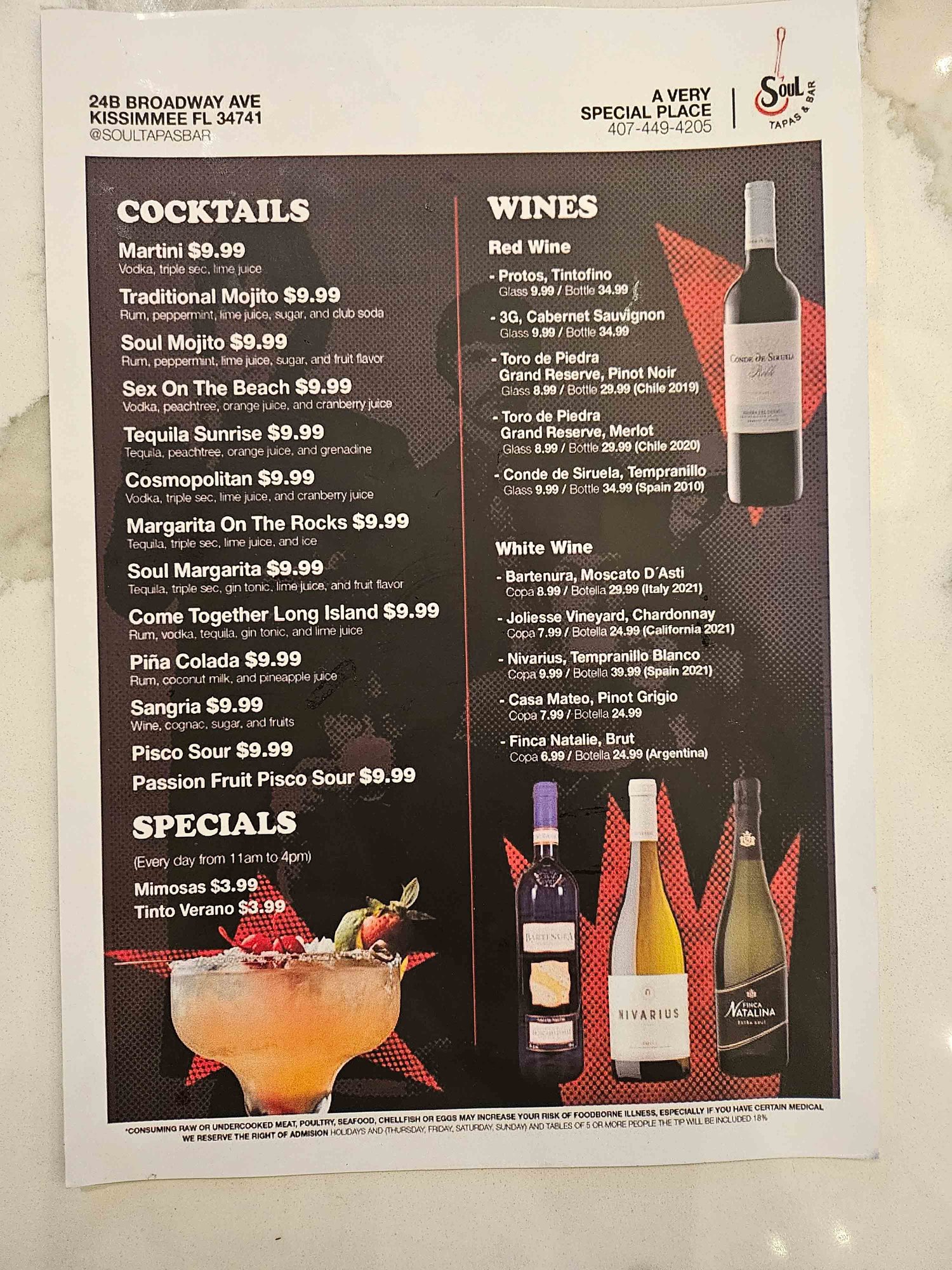 black laminated menu with alcoholic drinks and images
